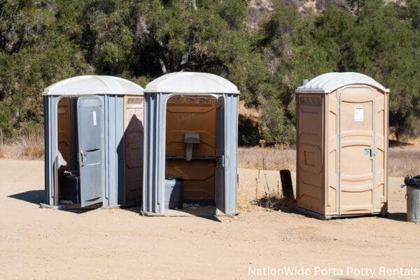 a clean row of portable restrooms for outdoor weddings or festivals in Windfall, IN